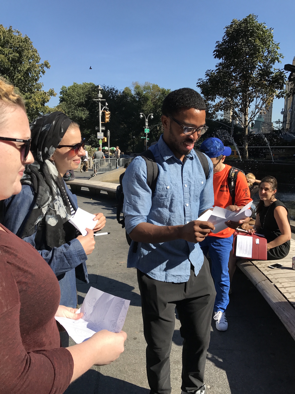 Students read from papers